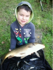Young Callum with a 6lb plus carp taken in a mixed bag from Skilts pool. 2013.